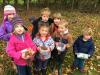 A group of children collecting acorns.