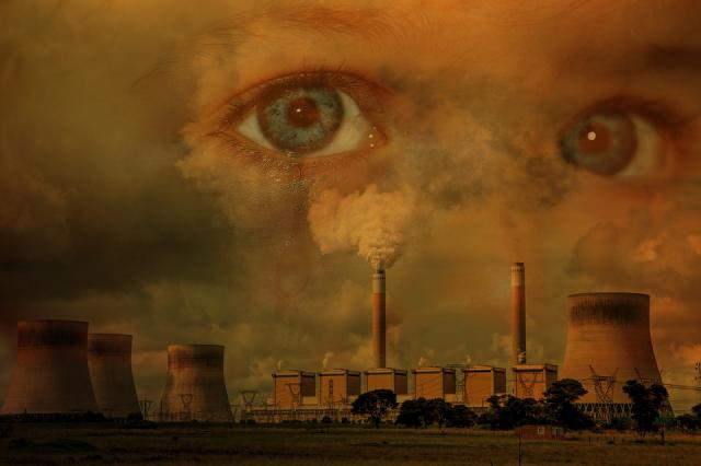 Image of child in sky looking worried with factories billowing smoke in foreground